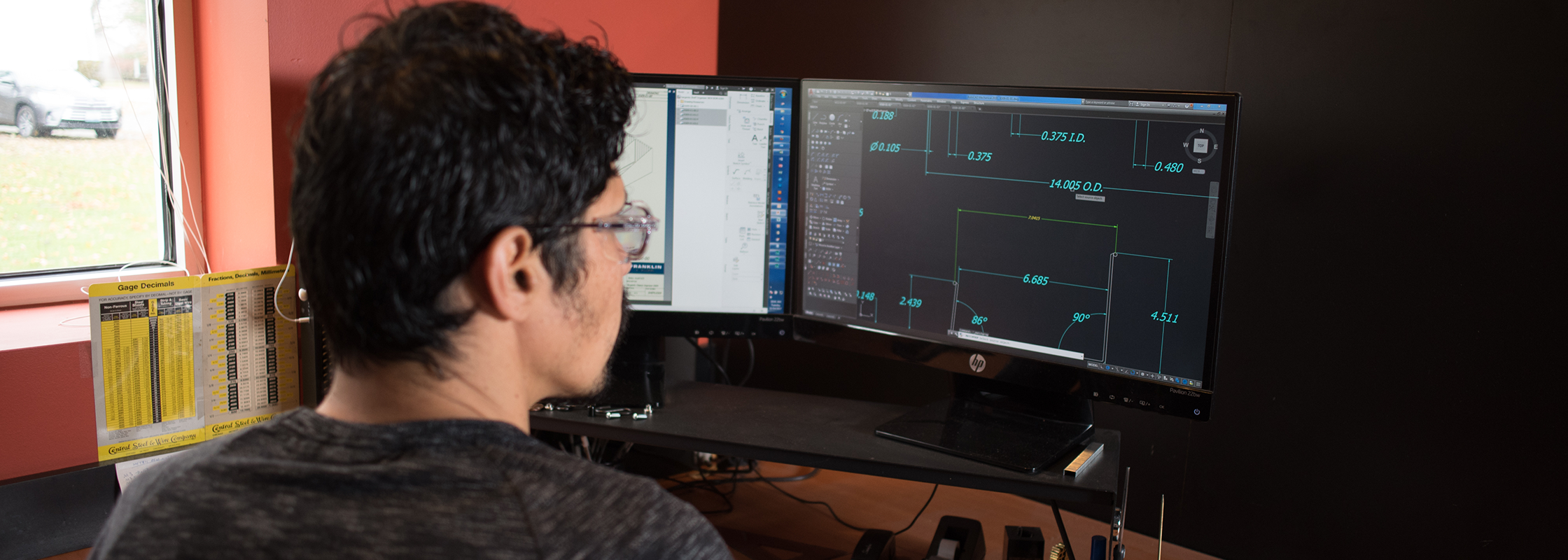 Design engineer working at a computer