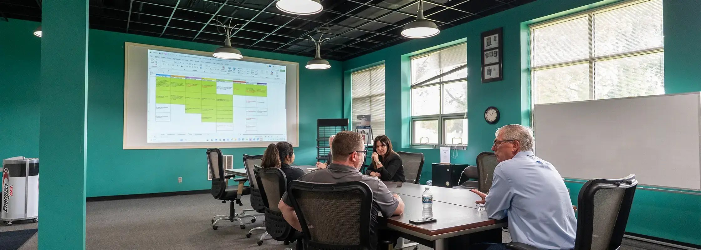 Employees at Franklin Display discuss custom display manufacturing
