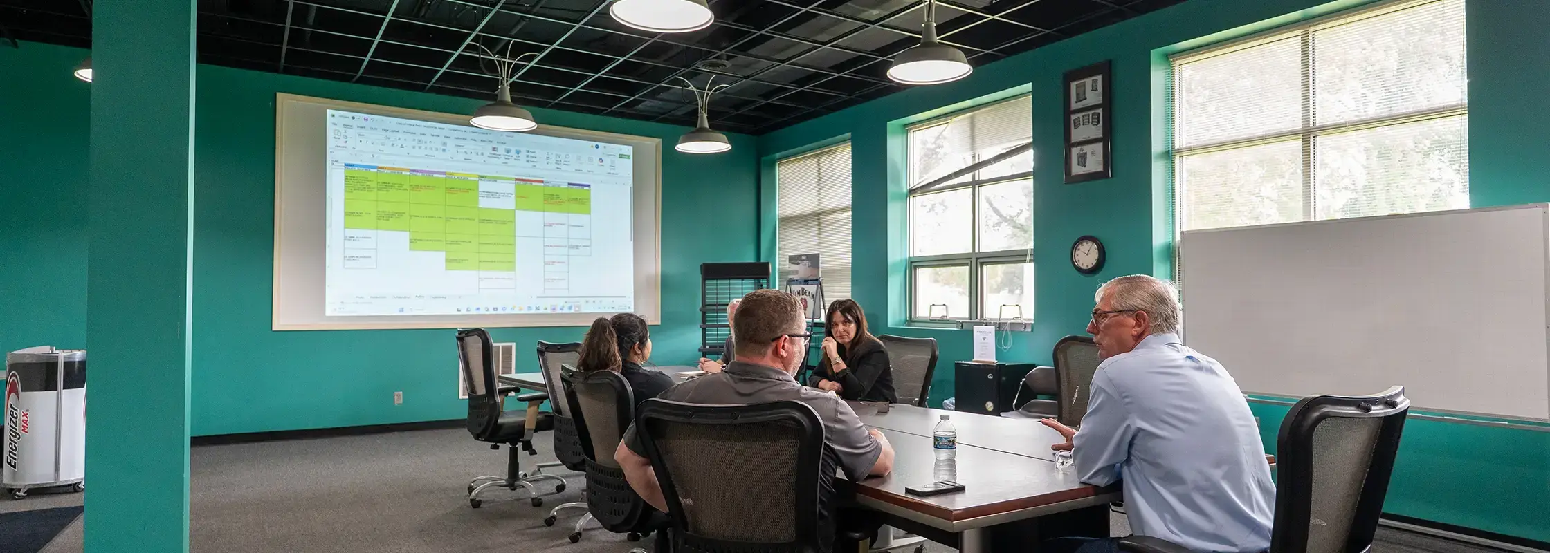 Franklin employees discussing custom display manufacturing